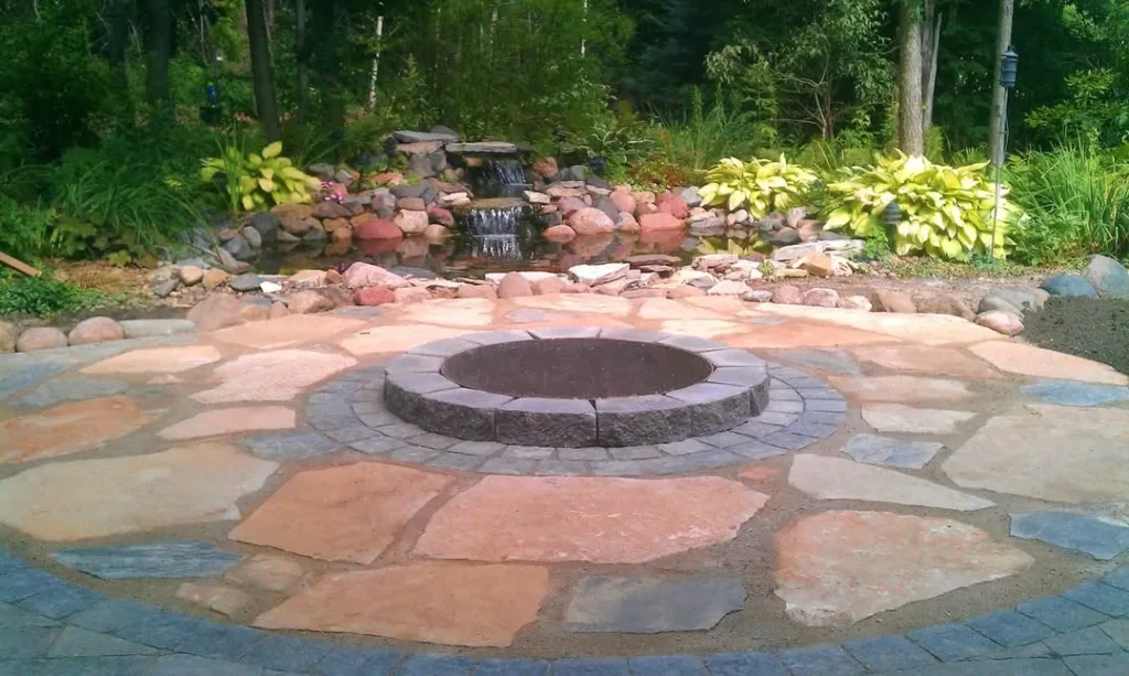 Natural Stone Fire Pit with Water Feature Backdrop