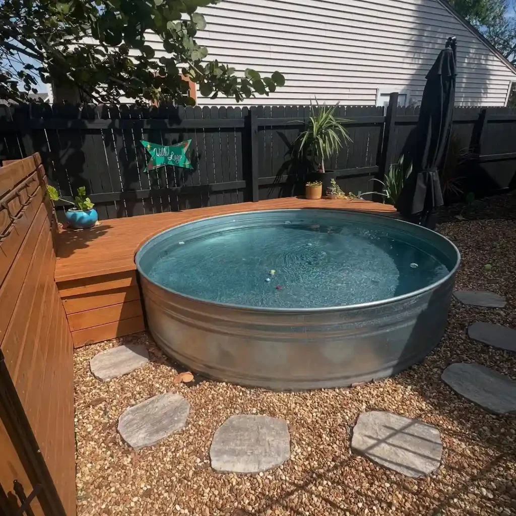 Backyard Stock Tank Pool with Gravel Landscaping