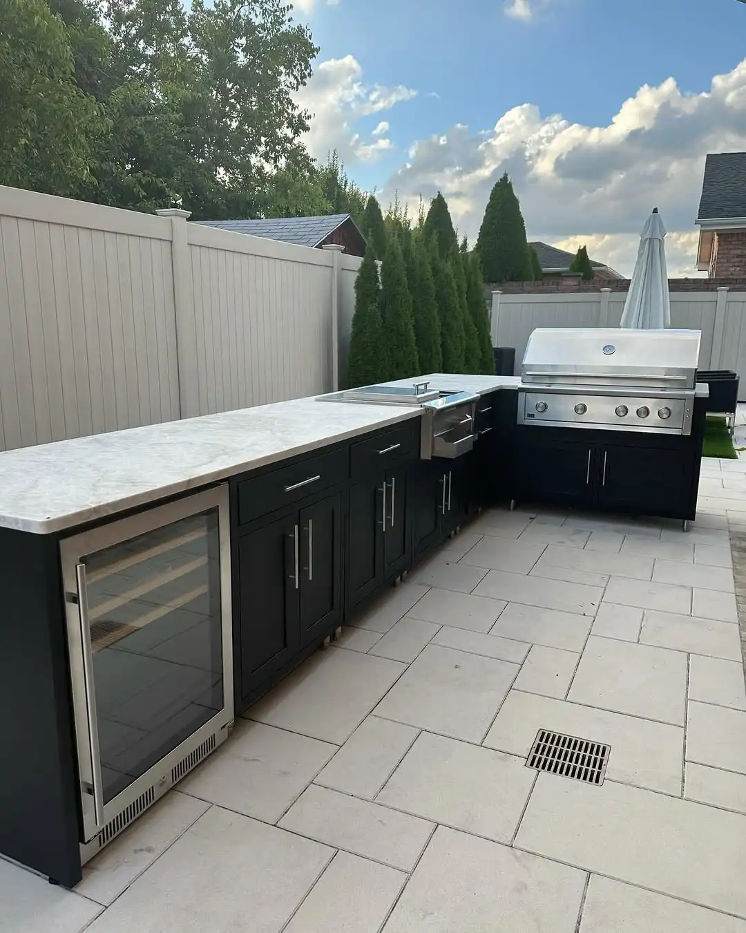 Expansive L-Shaped Outdoor Kitchen with Wine Refrigerator