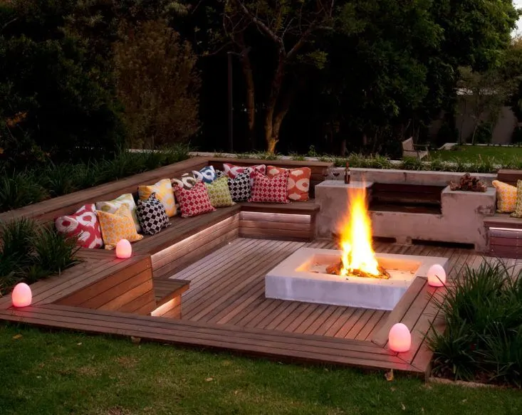 Contemporary White Fire Pit with Built-In Wooden Bench Seating