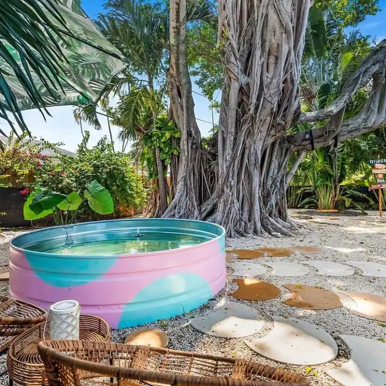 Artistic Tie-Dye Stock Tank Pool in Tropical Setting