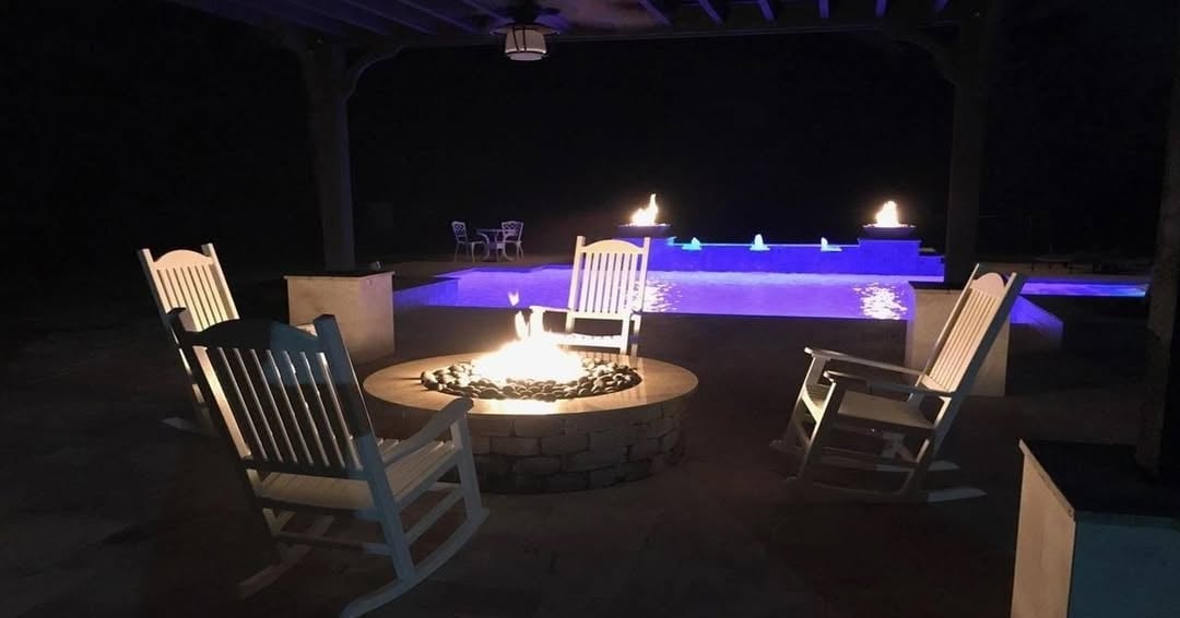 Round Stone Fire Pit with Classic Rocking Chairs