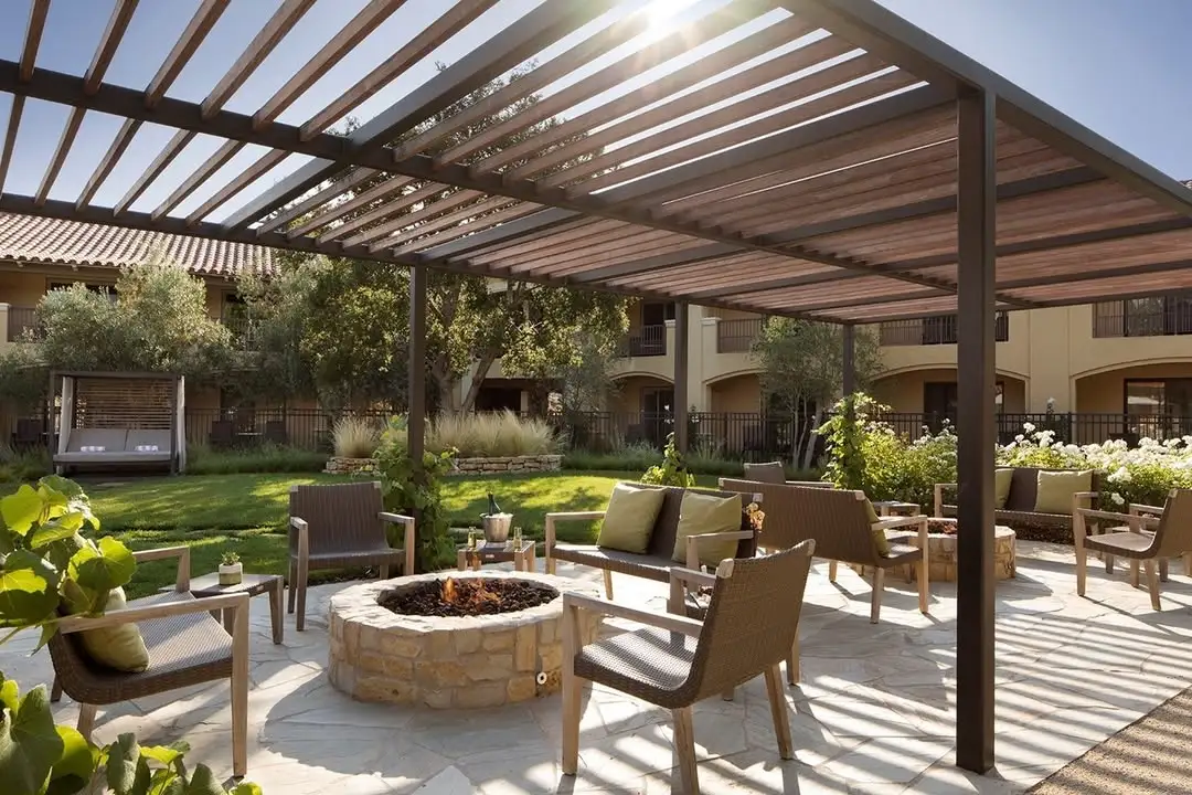 Luxury Resort-Style Fire Pit with Natural Stone and Pergola Shelter
