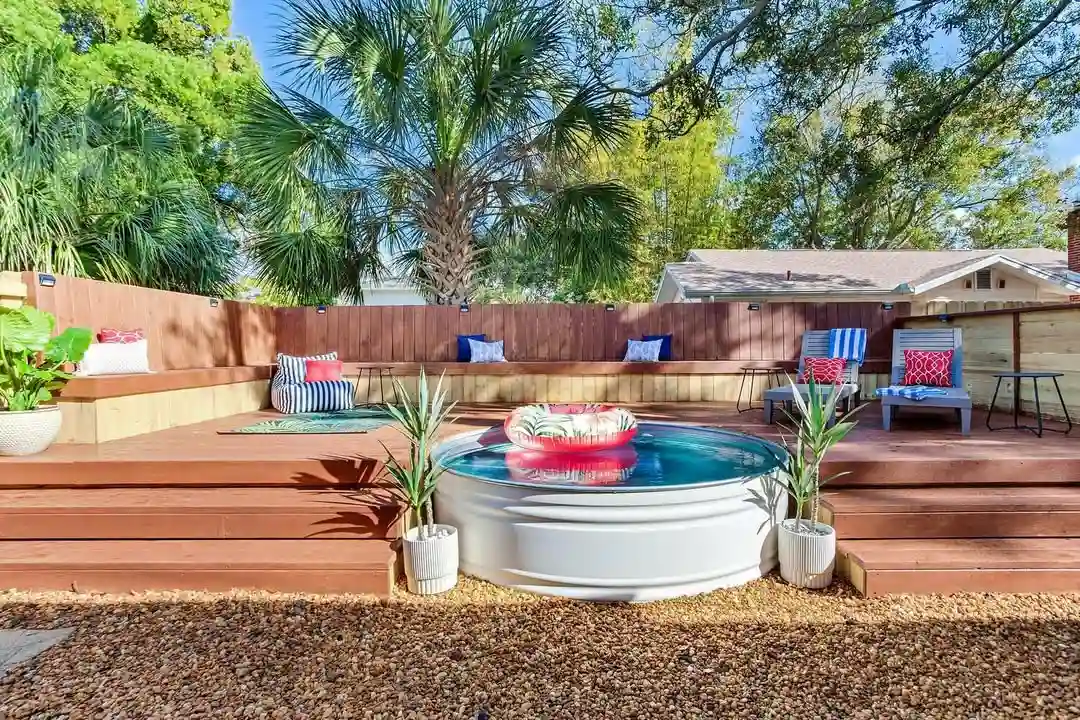 Modern Backyard Stock Tank Pool with Multi-Level Deck