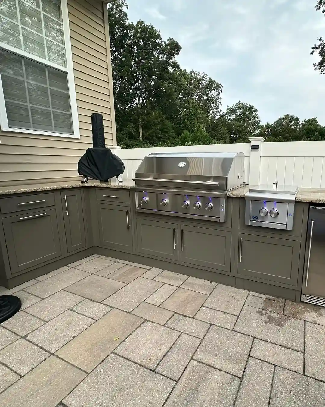 Sage Green L-Shaped Outdoor Kitchen with Premium Appliances