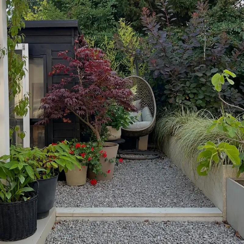 Secluded Gravel Nook with Woven Egg Chair