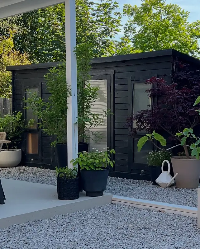 Modern Matte Black Garden Studio and Container Plants